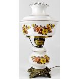A 20th century white glass oil lamp with floral decorated base and oil reserve to a decorative
