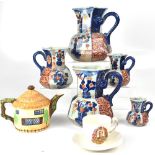 A graduated set of five Imari pattern ironstone jugs, height of largest 25cm,