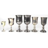 Two pairs of electroplated chalices of typical form,