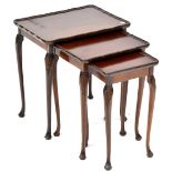 A nest of three mahogany side tables, each with carved shell kneecaps,