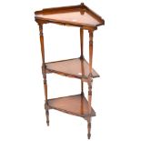 An Edwardian mahogany three-tier whatnot with turned supports to peg feet, height 99cm.