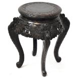 An Oriental carved hardwood jardinière stand,