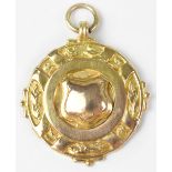 A George V 1927 9ct gold prize fob awarded to F Yates for the 'Horrockses Inter-Mill Bowling