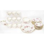 A floral decorated and gilt heightened 'CSC The Paragon China' tea service comprising nine cups,