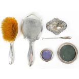 Various items of hallmarked silver to include a dressing table hand mirror and brush (filled),