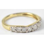 A 9ct yellow gold half eternity ring set with nine diamonds, size L, approx 1.8g.