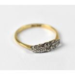 A 9ct yellow gold dress ring set with five illusion set diamonds, approx 1.5g.