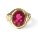 A vintage 9ct gold gentlemen's signet ring with oval cut ruby coloured stone in bezel setting and