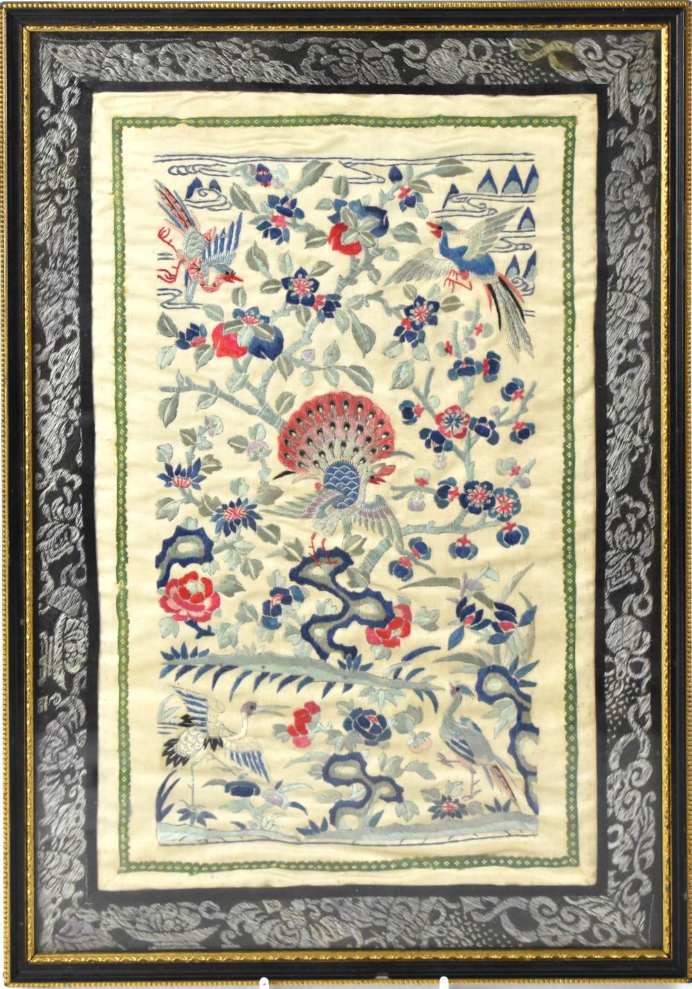 An Oriental embroidered silk panel of birds amongst flowers, within simple border, 41 x 28cm,