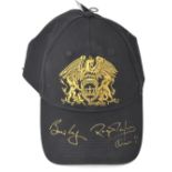 QUEEN; a cap bearing the signatures of Brian May and Roger Taylor in gold pen.