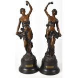 A pair of early 20th century spelter figures of young ladies partially-clad in Classical dress and