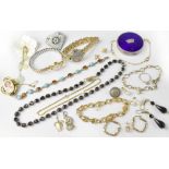 Various items of costume jewellery to include a pair of gold twist hoop earrings,