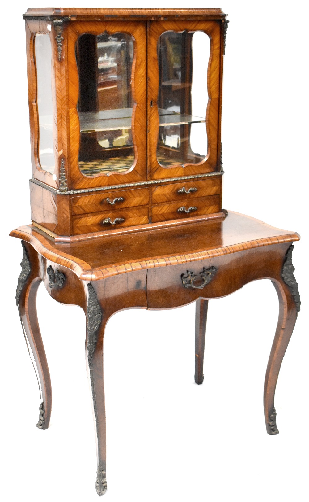 A 19th century flame mahogany bonheur du jour twin glazed display cabinet with glazed panels to