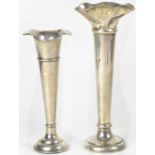 Two Walker & Hall hallmarked silver trumpet form specimen vases, the larger with flared rim,