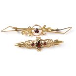 Two 19th century 9ct gold garnet brooches, one set with large garnet flanked by two smaller stones,