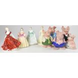 A set of five Wade NatWest pig money banks and four Coalport 'Ladies of Fashion' comprising