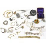 Various items of costume jewellery to include yellow metal earrings, a chrome sovereign holder,