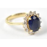 A 14ct yellow gold sapphire and diamond ring, size N1/2, approx 3.5g.