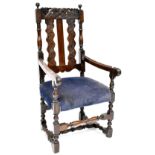 An early 19th century Victorian oak armchair/carver,