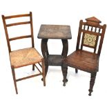 A late Victorian oak hall chair with tiles set to the back,