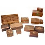 Eleven vintage and modern carved wooden boxes decorated with inlaid brass stringing,