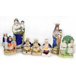 A group of late 19th/early 20th century figures to include three Staffordshire figures of the Three