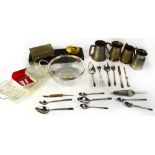 A quantity of silver plated ware to include serving dishes, a carving set, various cutlery, mugs,