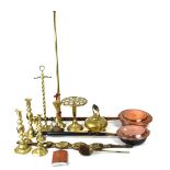 A quantity of mixed metalware to include a brass trivet, various brass candlesticks,