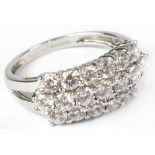 A 14ct white gold ring set with three rows of white stones totalling nineteen stones, size R,