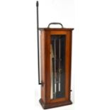 An early/mid-20th century hygrometer with glazed front panel and elevated side rod,