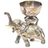 A late 19th/early 20th century Oriental hollow cast electroplated elephant shown wearing headdress
