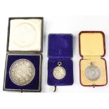 Two early 20th century silver Life Saving medals, both in presentation cases,