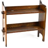 An early 20th century oak tabletop two-tier open bookshelf with shaped sides, 46.5 x 52 x 16.5cm.