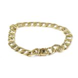 A gentlemen's 9ct gold flat curb bracelet with push-in clasp and safety bar, length 20cm, approx 13.