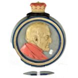 A painted cast metal embossed plaque depicting the Duke of Wellington,