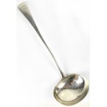 A hallmarked silver soup ladle inscribed to the top 'J.