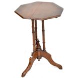 An early 20th century mahogany octagonal side table to turned and outswept tripartite support,