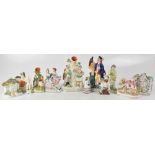 A group of twelve late 19th/early 20th century Staffordshire figures,