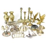 A group of metalware including a pair of candlesticks, a pair of vases,