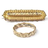 A 9ct gold eternity band ring set with a band of white stones (two stones missing),
