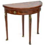 A reproduction inlaid demi-lune fold-over card table,