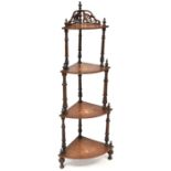 A 19th century inlaid mahogany four-tier whatnot, fan and shell carved top with urn finials,