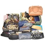 A large selection of vintage handbags to include woven examples, a Moda blue leather bag,