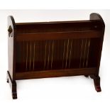 A contemporary mahogany magazine rack to outswept supports, 35 x 49 x 24cm.