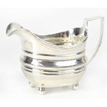 A George III hallmarked silver creamer with chased line decoration, maker's mark rubbed,
