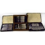 Three cased sets of hallmarked silver flatware, a George V set of six pastry knives and forks,