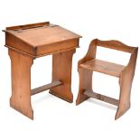 An early 20th century child's desk with push-under seat,