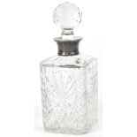 A square section cut glass decanter with a hallmarked silver collar inscribed 'Curry's Ltd for