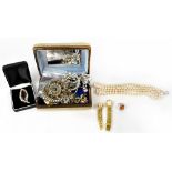 A collection of costume jewellery to include a dress ring set with orange glass, faux pearls,
