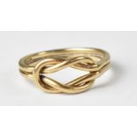 A 9ct gold ring with entwined knot design, on double wire shank, size P, approx 3g.
